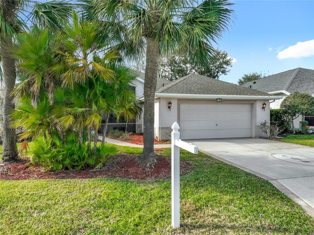 5685 Gulf Stream Street Tavares, FL 32778 - Photo 7 of 78 a front view of house with a garden