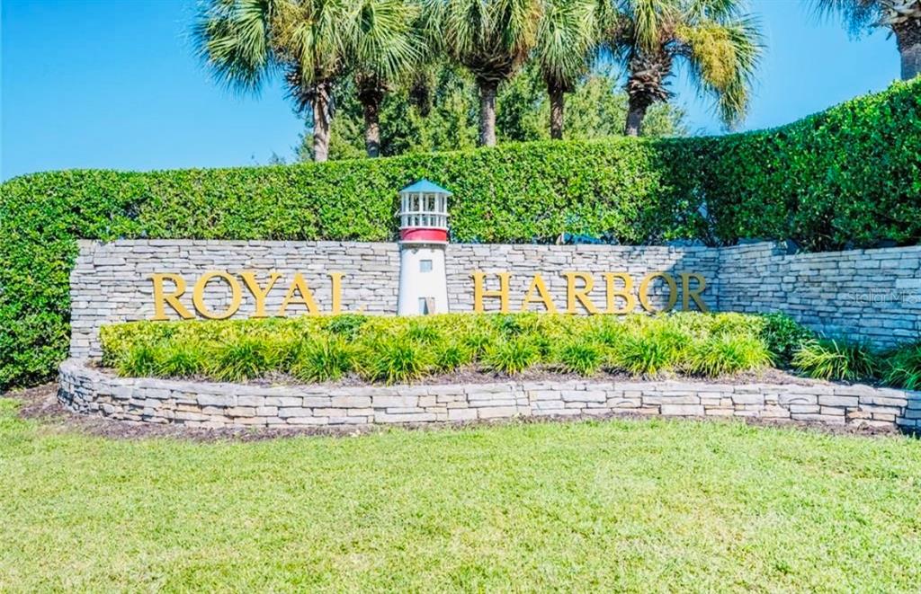 5685 Gulf Stream Street Tavares, FL 32778 - Photo 9 of 13 a view of a garden with a bench