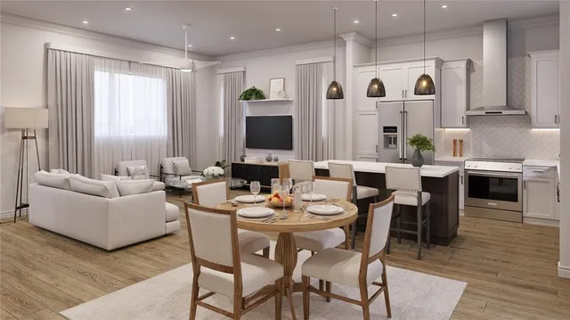 a view of a dining room with furniture and wooden floor