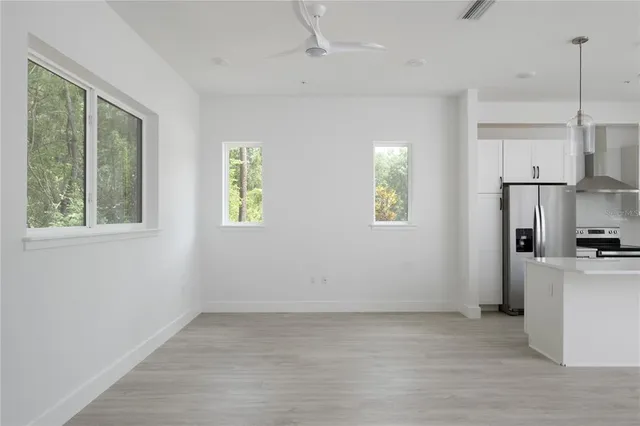a view of a kitchen with a stove cabinets and a wooden floor