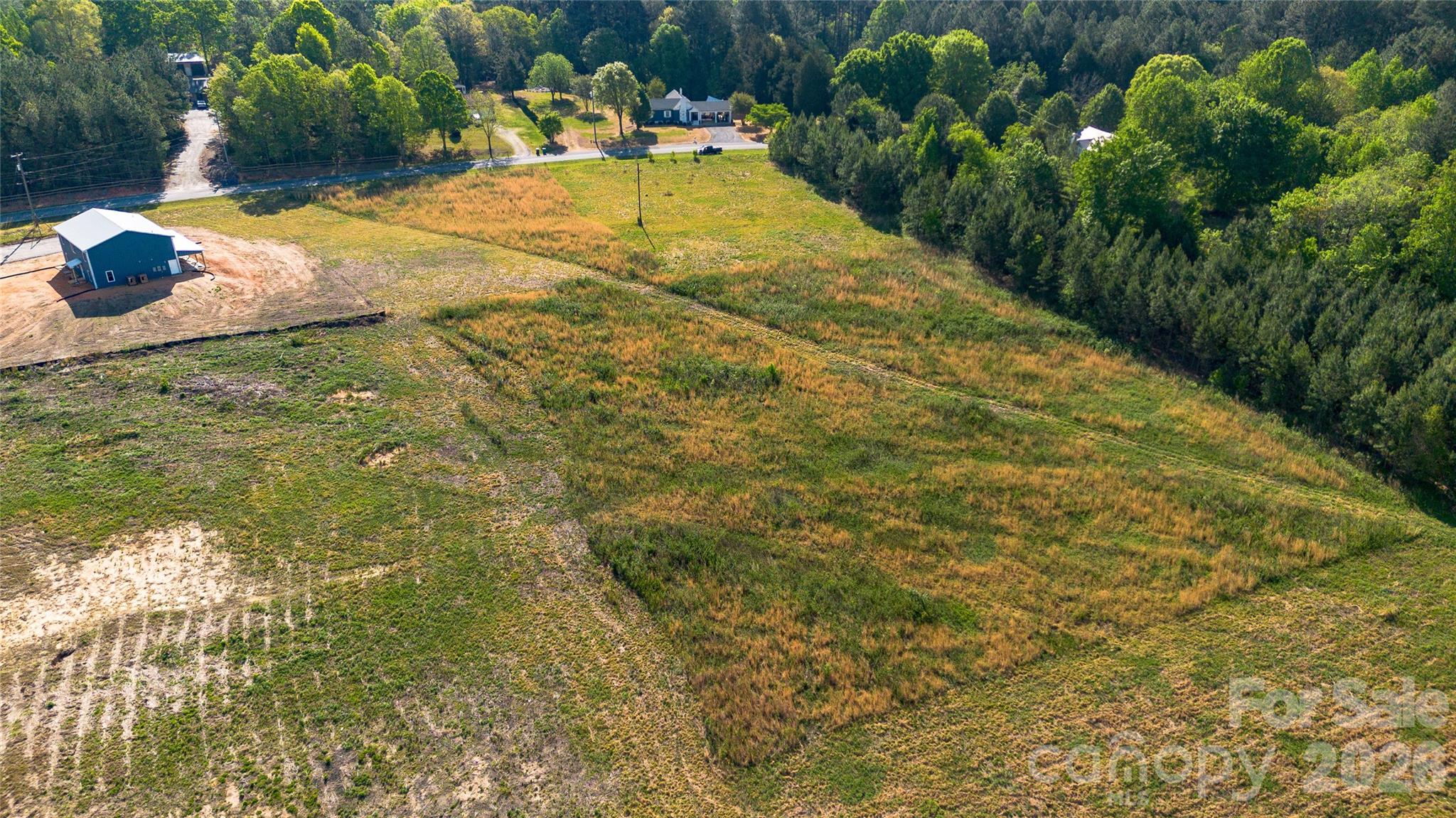 1075 Ring Tail Road Claremont, NC 28610 - Photo 6 of 12 a view of a backyard of the house