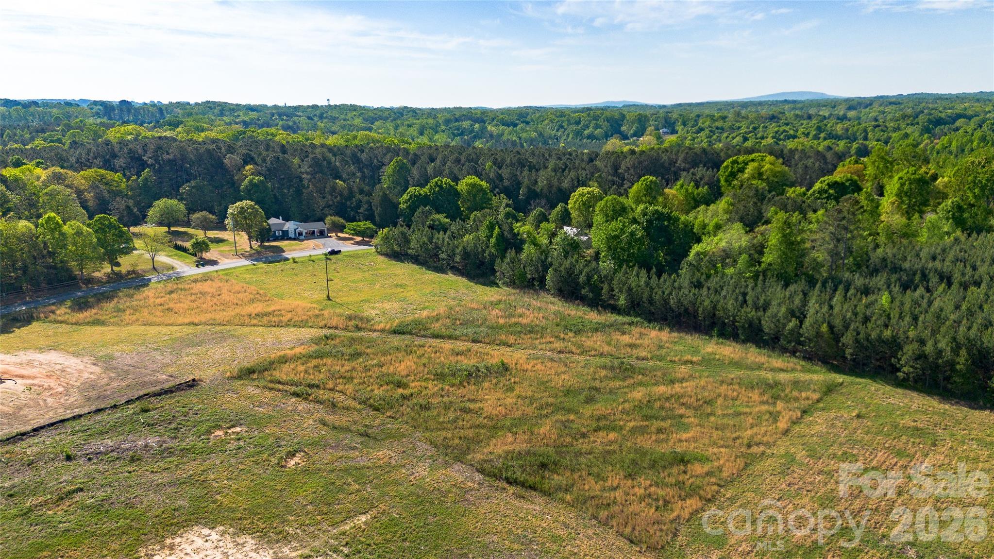 1075 Ring Tail Road Claremont, NC 28610 - Photo 7 of 12 a view of a swimming pool with a yard