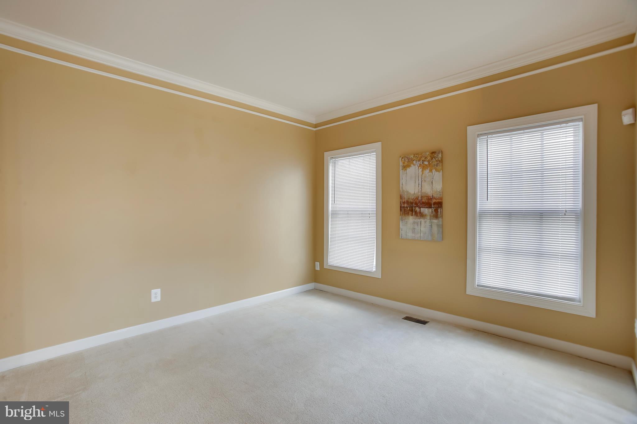 Formal living room with crown molding.