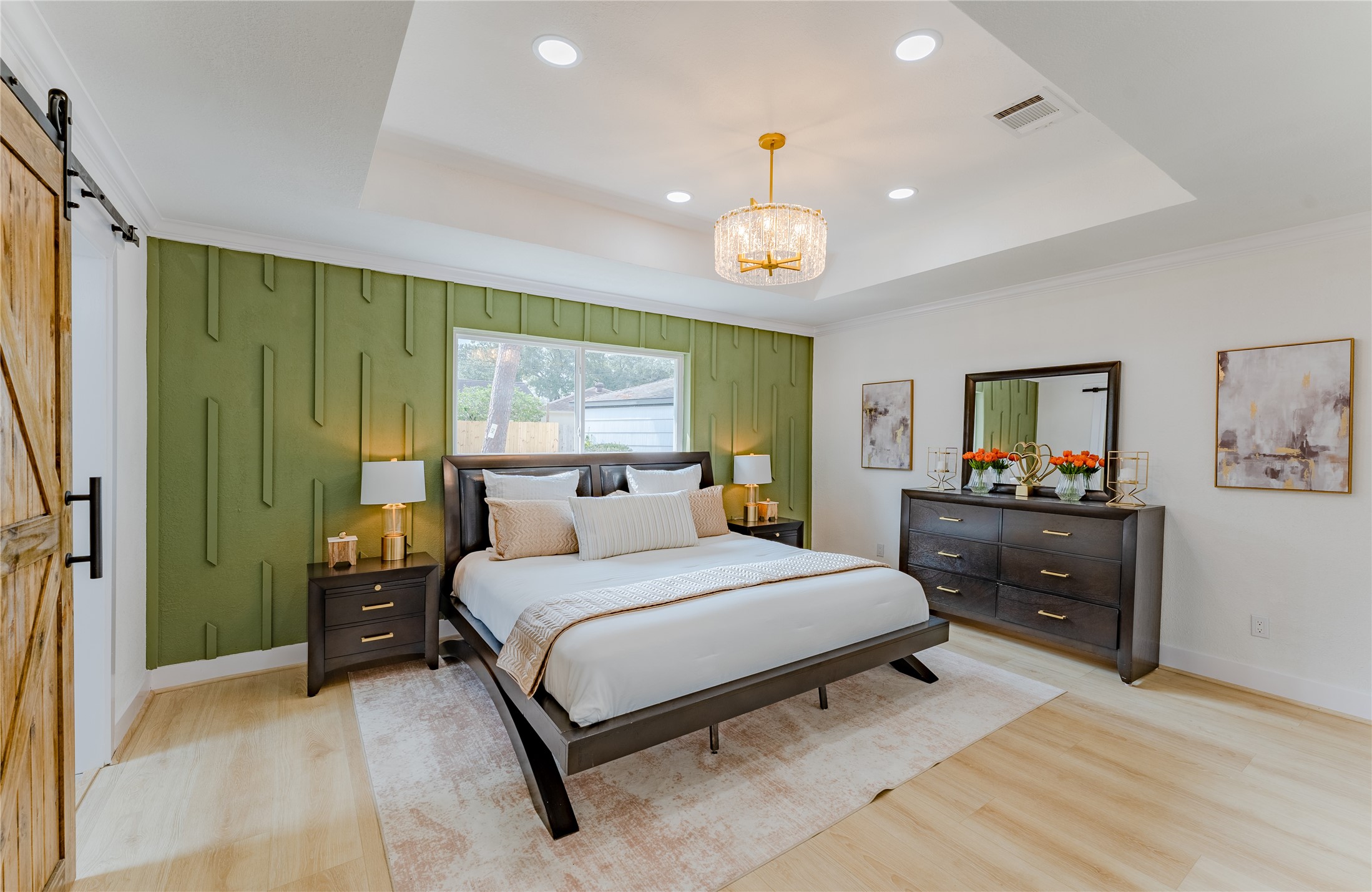 6027 Valkeith Drive Houston, TX 77096 - Photo 18 of 31 a bedroom with a bed and a flat screen tv