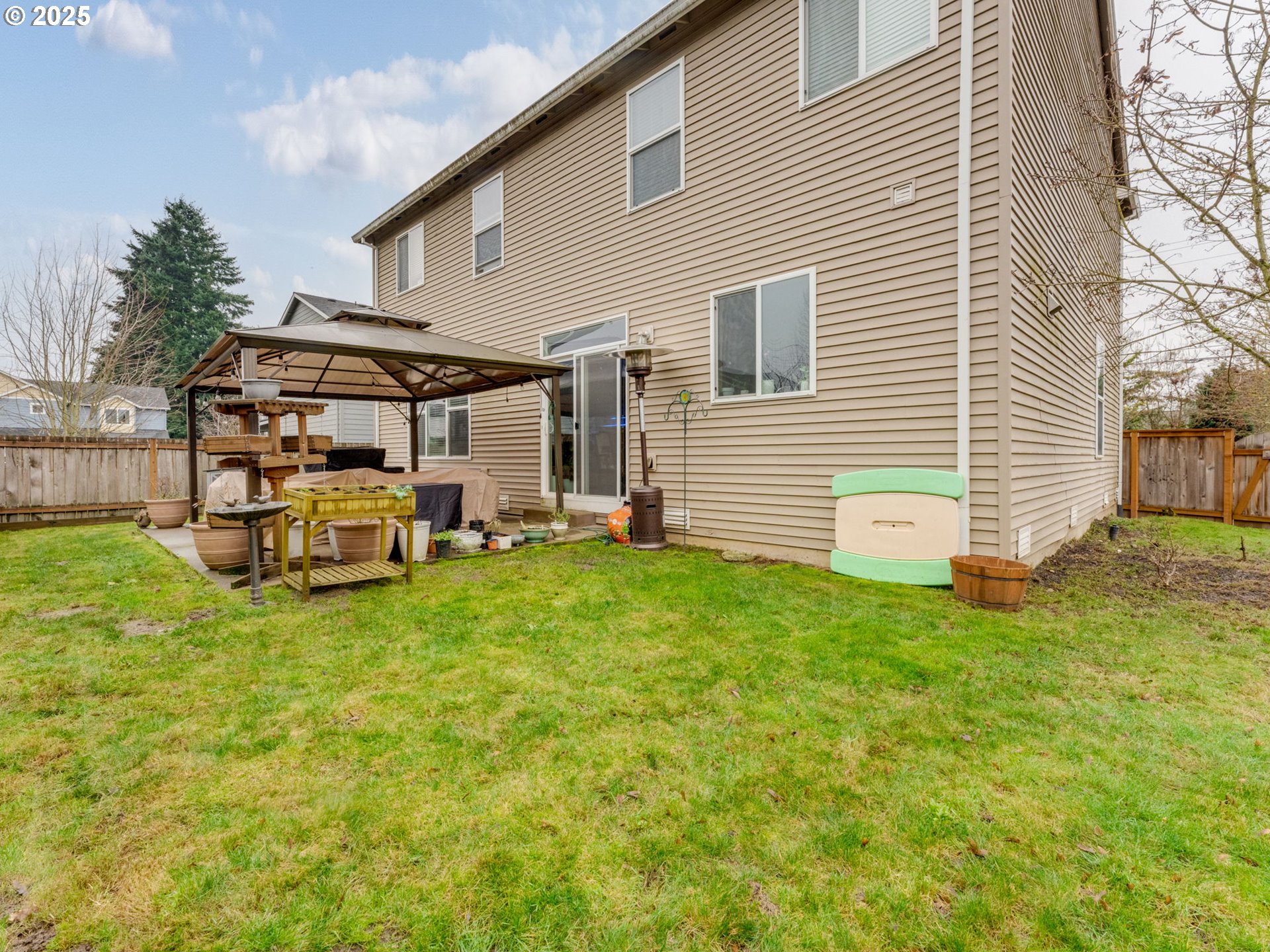 52144 Southeast 8th Street Scappoose, OR 97056 - Photo 41 of 48 a backyard of a house with table and chairs