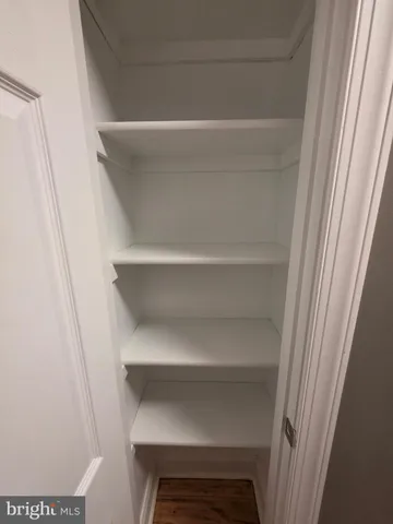 a view of small space with racks on the wall