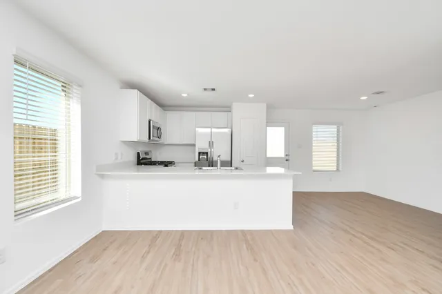 a view of kitchen with wooden floor