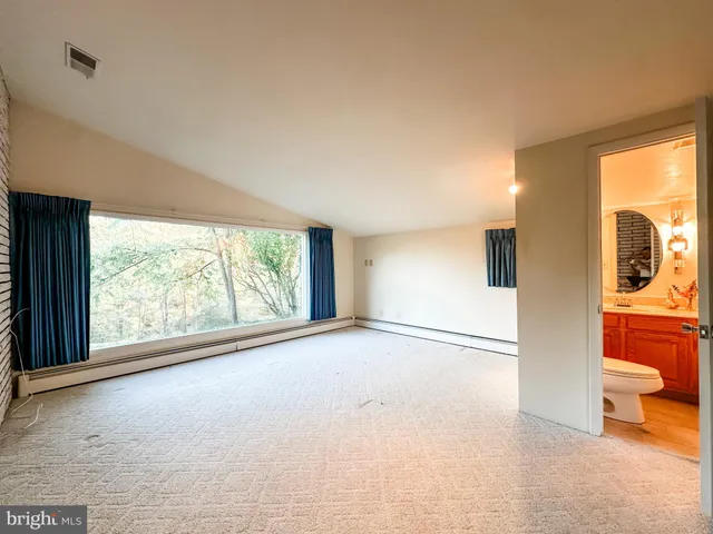 a view of a room with large windows