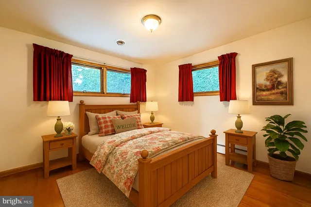 a bedroom with a bed and a table in it