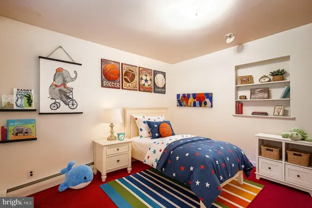 a bedroom with a bed and cabinets