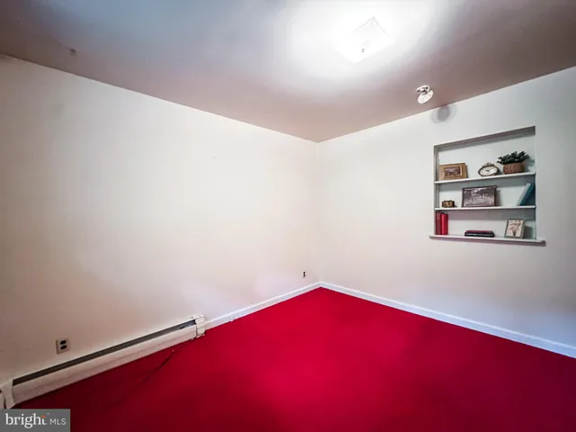 a spacious bathroom with a sink double vanity and a large mirror