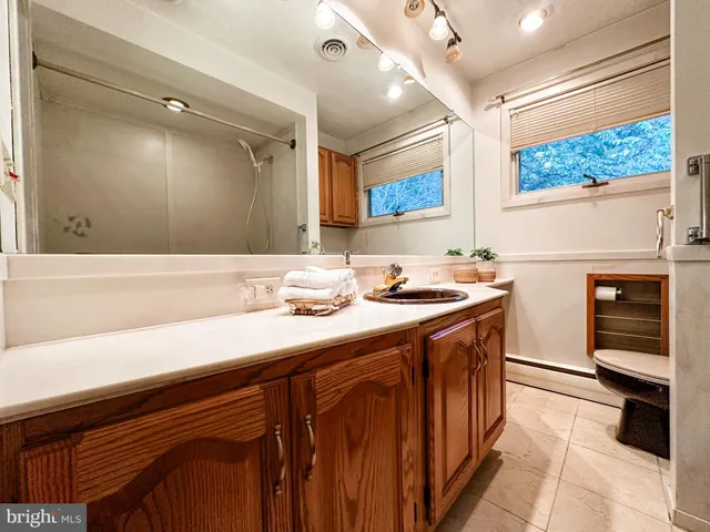 a bathroom with a bathtub and a shower