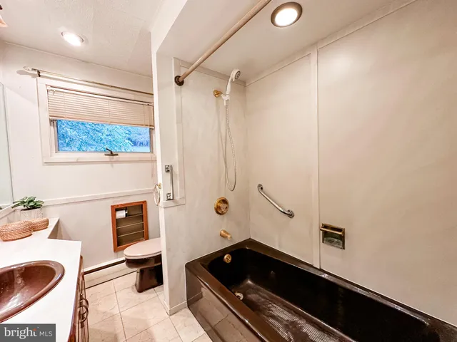 a kitchen with cabinets and appliances
