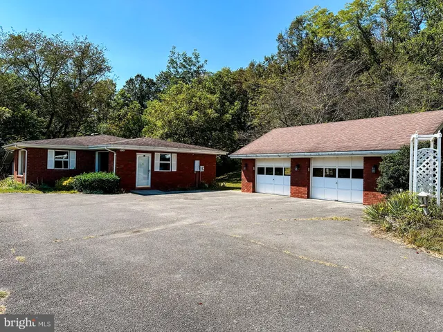 a view of empty room with wooden walls