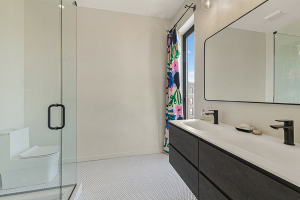 2135 West Cermak Road, Unit 3S Chicago, IL 60608 - Photo 13 of 14 a bathroom with a sink and a mirror