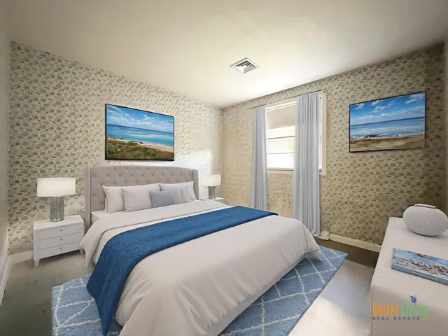 a bedroom with a bed and a painting on the wall