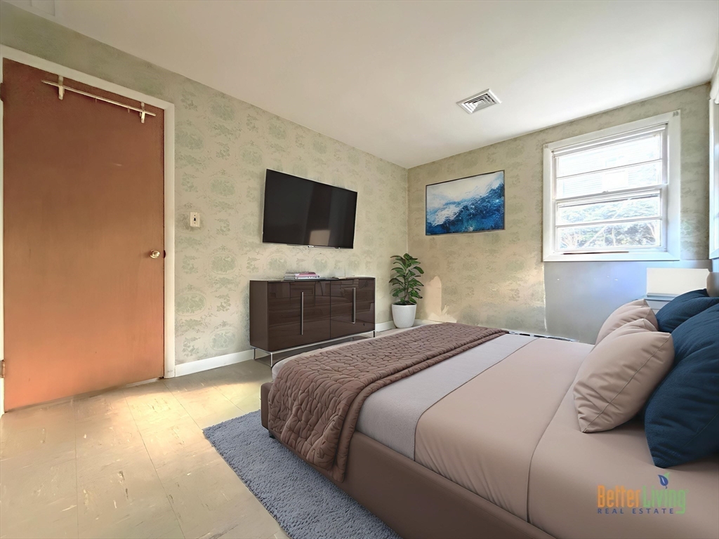 43 Chandler Avenue Walpole, MA 02081 - Photo 12 of 23 a bedroom with a bed and a fireplace