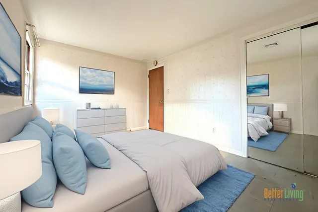 a bedroom with a bed and a couch