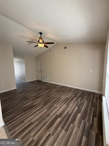 a kitchen with a sink cabinets and window