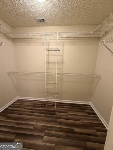 a spacious bathroom with a bathtub and a shower