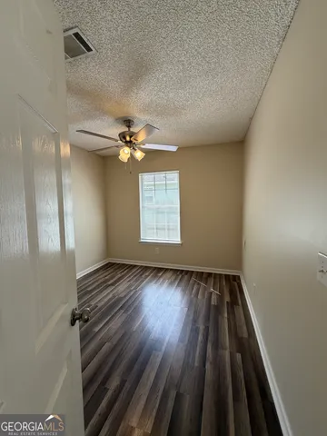 a view of livingroom with hardwood floor and a ceiling fan