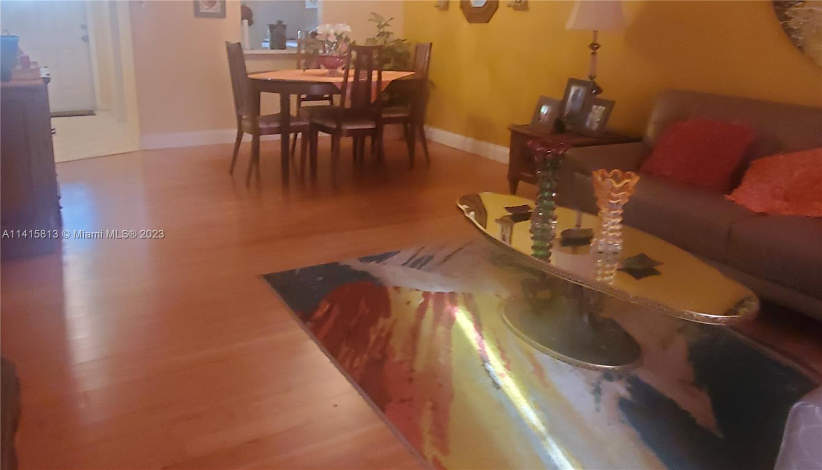 Oriole Gardens Margate, FL 33063 - Photo 3 of 20 a view of a dining room with furniture and wooden floor