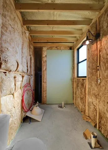 a view of a room with wooden walls