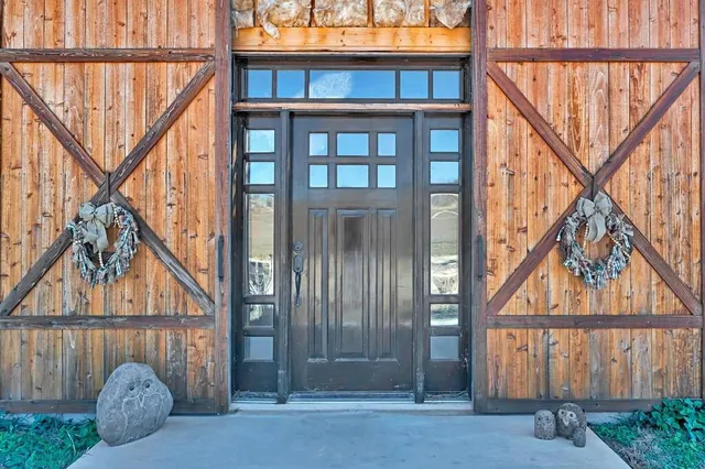 a front view of a house with a yard from a balcony