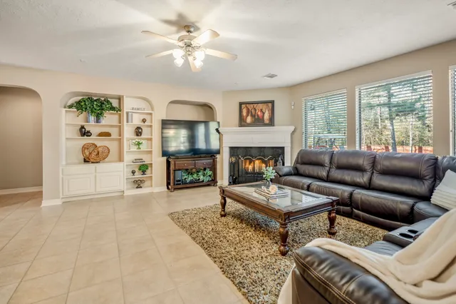 a view of a dining room with furniture and a window
