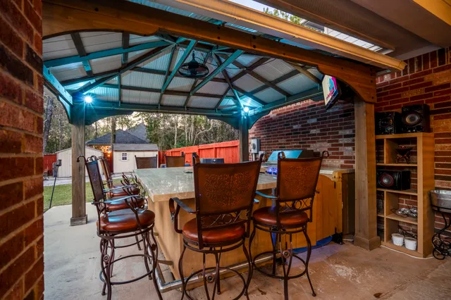 a view of a chairs and table in the patio