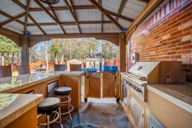 a view of a swimming pool with a couches and a patio