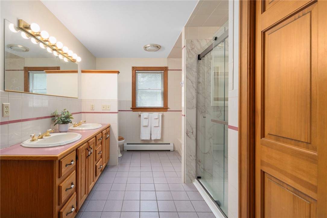 310 Plain Road West Greenwich, RI 02817 - Photo 21 of 39 Primary bath with double sink vanity, shower and separate tub