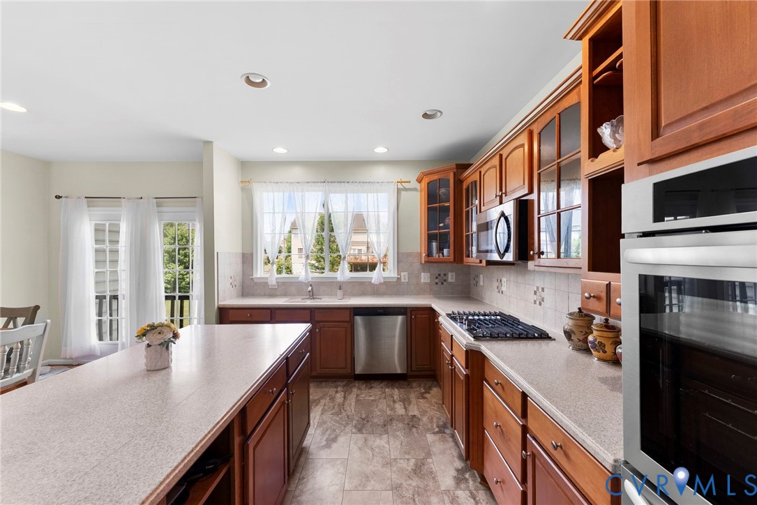 753 Blossom Tree Road Culpeper, VA 22701 - Photo 29 of 68 Kitchen featuring a central island with a solid su