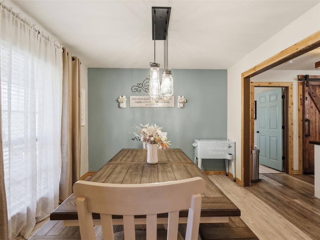 3823 State Highway Bonham, TX 75418 - Photo 4 of 37 a view of a dining room with furniture wooden floor and chandelier