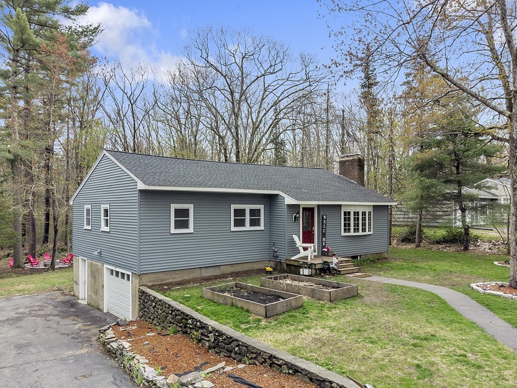 28 Banner Road Gardner, MA 01440 - Photo 29 of 31 a view of house with yard outdoor seating and covered with trees