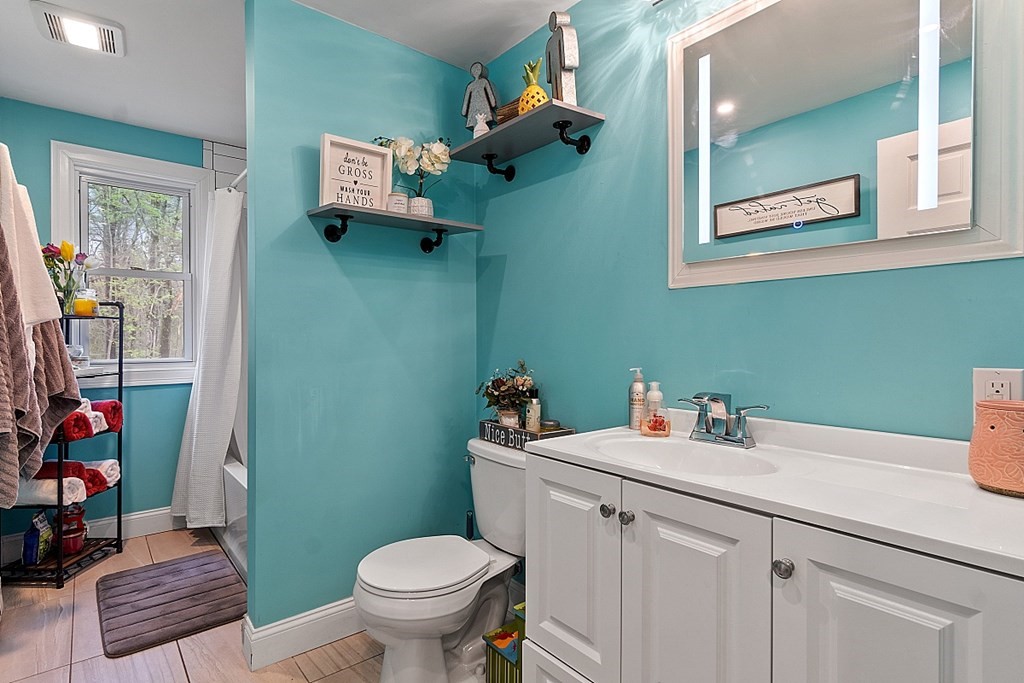 28 Banner Road Gardner, MA 01440 - Photo 8 of 31 a bathroom with a sink mirror vanity and toilet