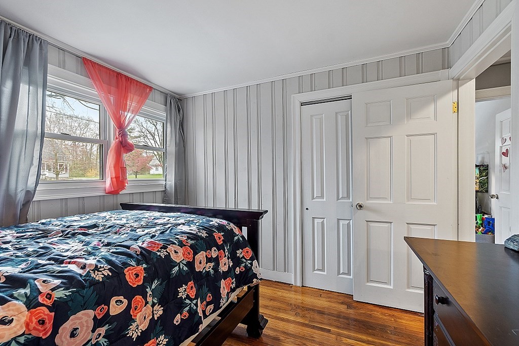 28 Banner Road Gardner, MA 01440 - Photo 9 of 31 a bedroom with a bed and wooden floor