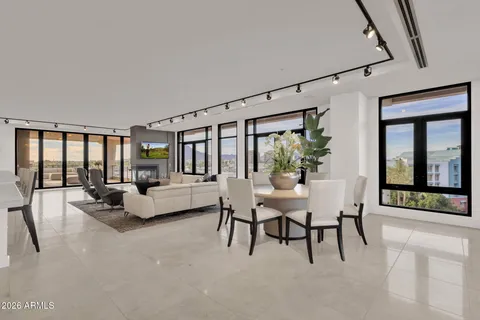 a terrace with outdoor seating and city view