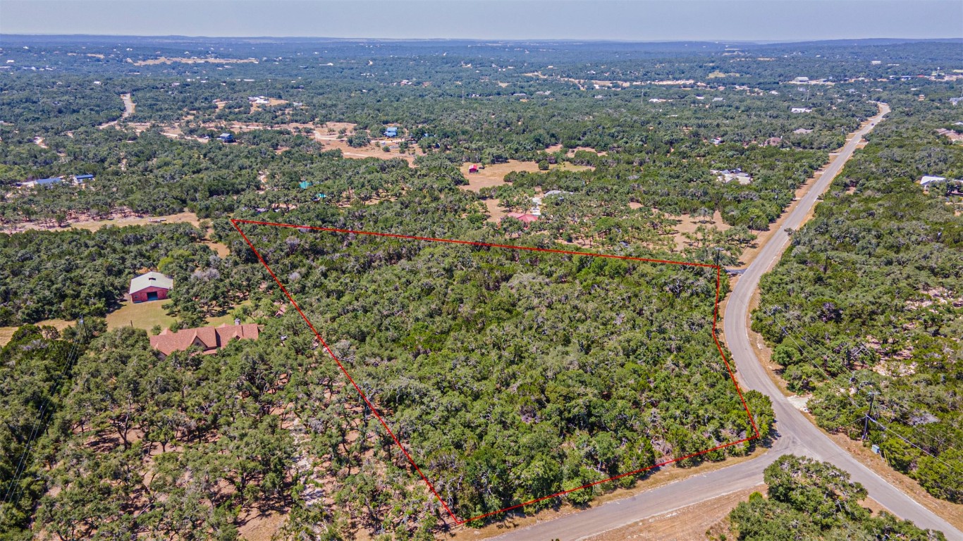 an aerial view of residential house and outdoor space