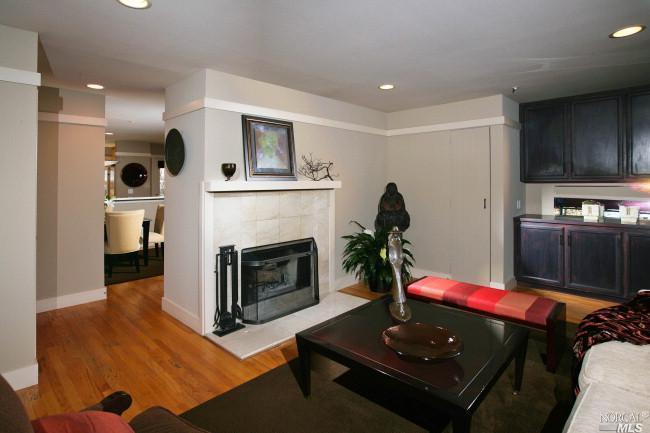 a living room with furniture flat screen tv and a fireplace