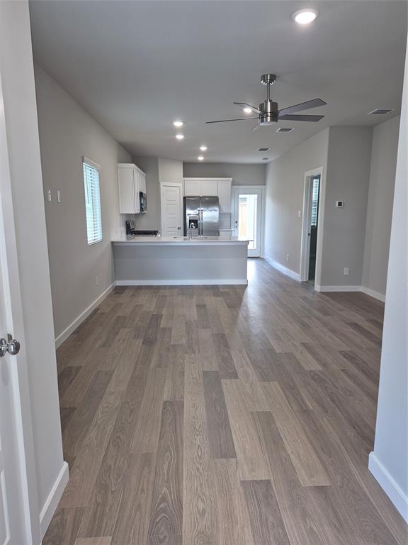 872 Sunflower Road Lavon, TX 75166 - Photo 4 of 12 a view of a kitchen from the hallway
