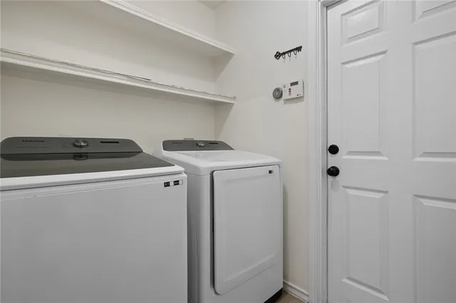 a view of a deck with a table and chairs