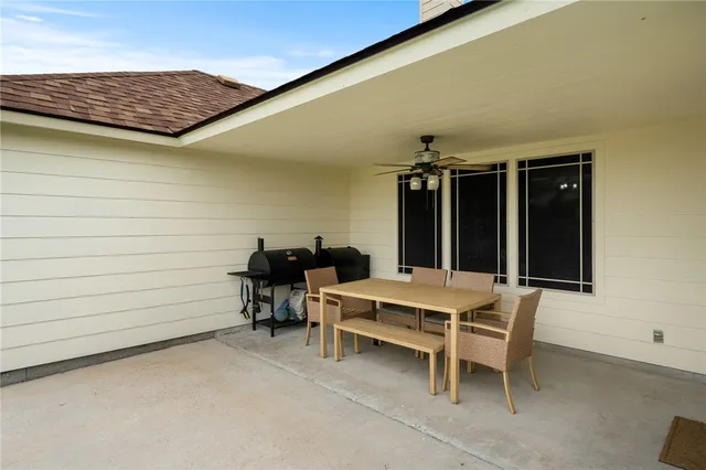 a view of a two chairs in the patio
