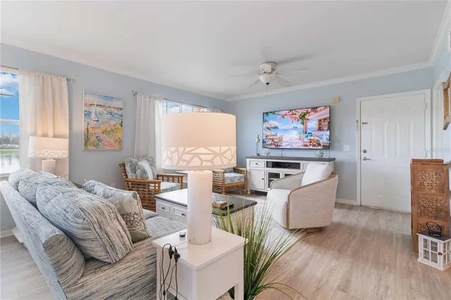 a kitchen with stainless steel appliances granite countertop a refrigerator and a stove