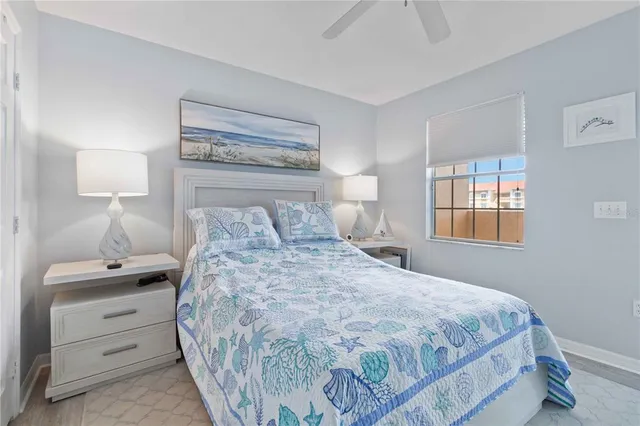 a bathroom with a sink a toilet a mirror and shower