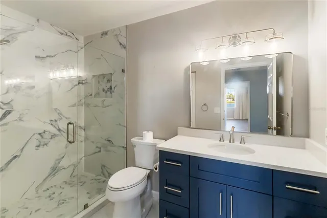 a bathroom with a bath tub and shower
