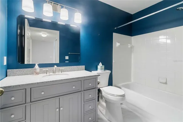 a view of a lake with houses in the back