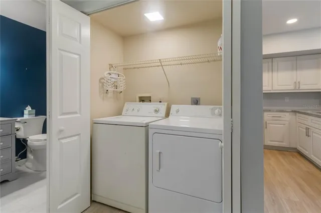 an aerial view of residential houses with outdoor space and river