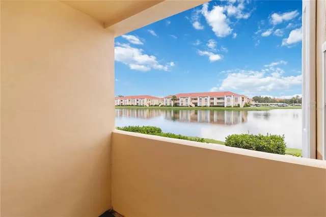 a view of a house with a swimming pool and a yard