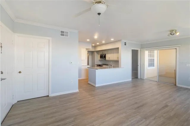a kitchen with stainless steel appliances granite countertop a sink a stove and a refrigerator